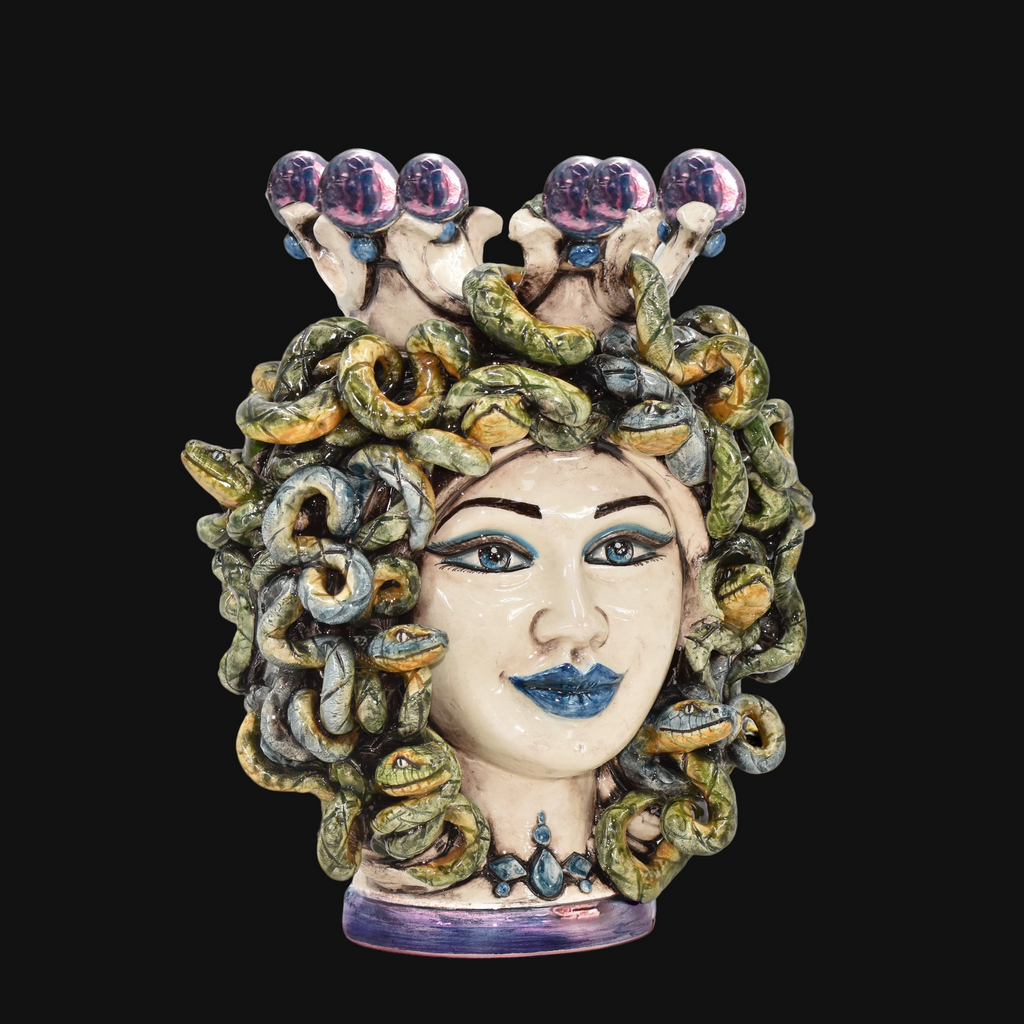 Handmade Medusa ceramic sculpture with snake hair, blue eyes, and crown, blending tradition and modern design.