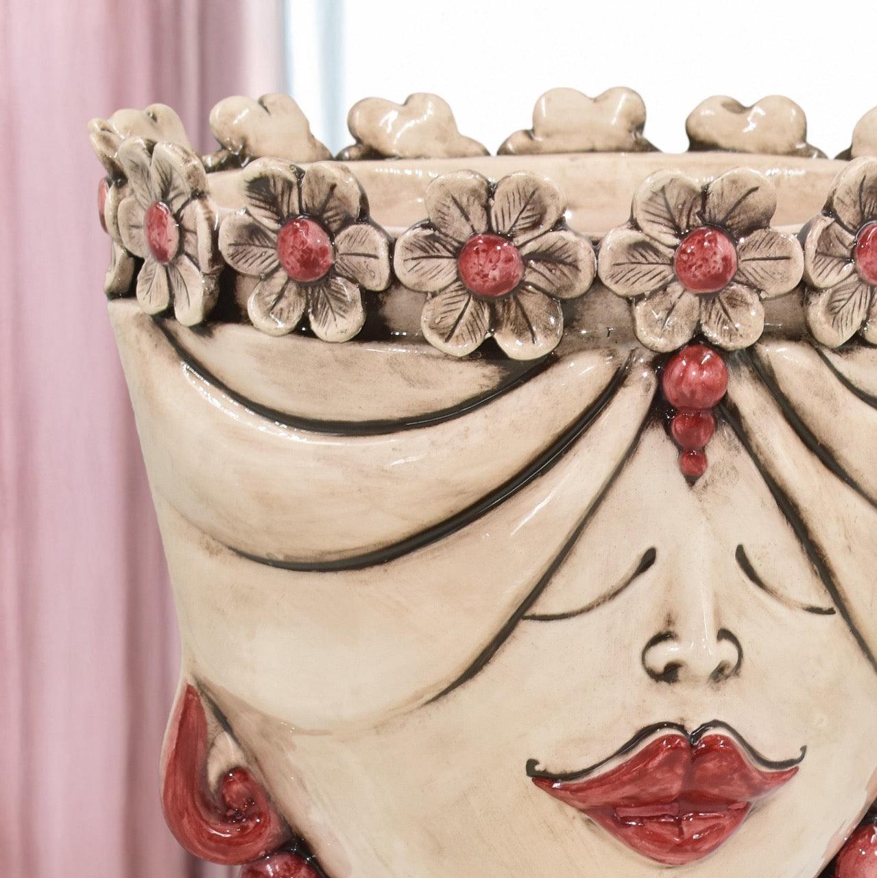 Handcrafted Teste di Moro vase with floral crown, red lips, and elegant ceramic design