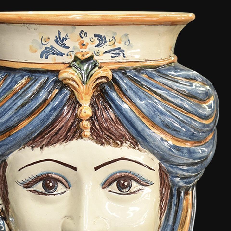 Handcrafted Teste di Moro ceramic vase with blue turban, floral details, and expressive eyes, blending tradition and modern design.