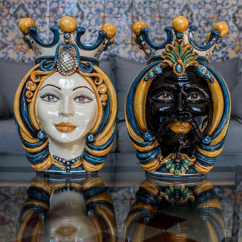 Handcrafted Teste di Moro ceramic sculptures with ornate crowns, vibrant blue and gold details, reflecting Sicilian tradition and modern design.