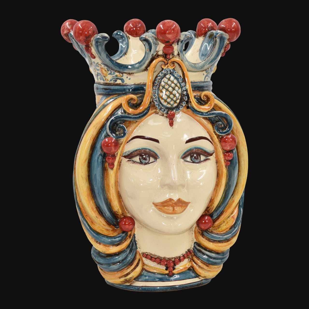 Handcrafted Teste di Moro ceramic vase with ornate crown, vibrant blue and gold swirls, red beads, and expressive face