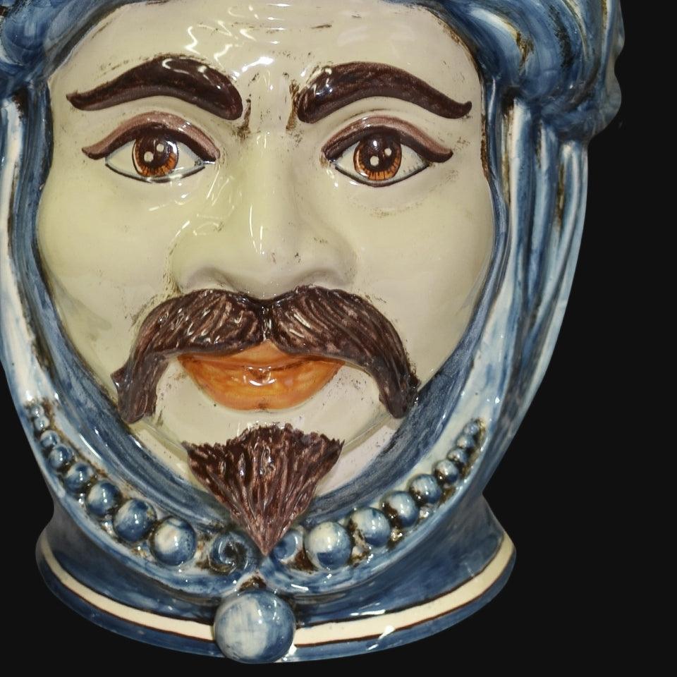 Handmade Teste di Moro ceramic face with blue hair, brown mustache, and beard, traditional Sicilian decor