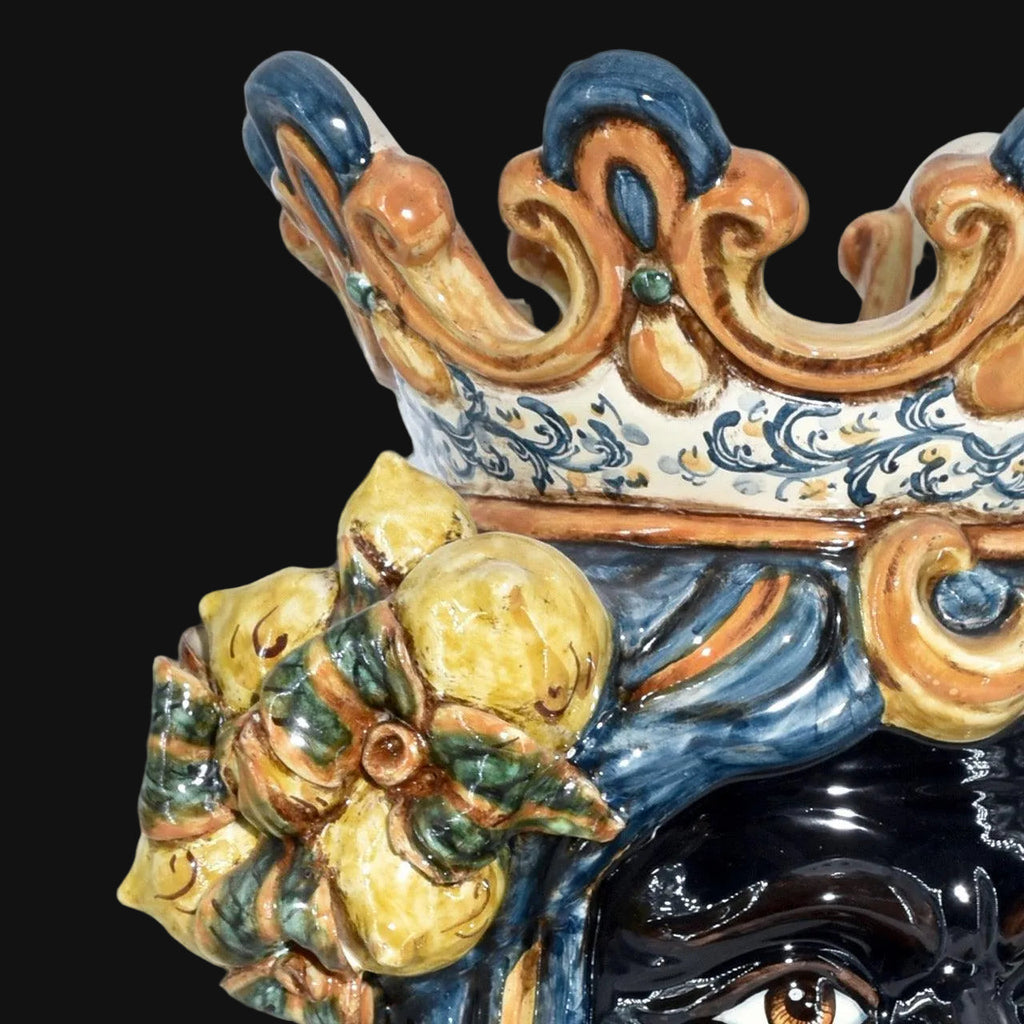 Handcrafted Teste di Moro ceramic with ornate crown and lemon motif, blending tradition and modern design.