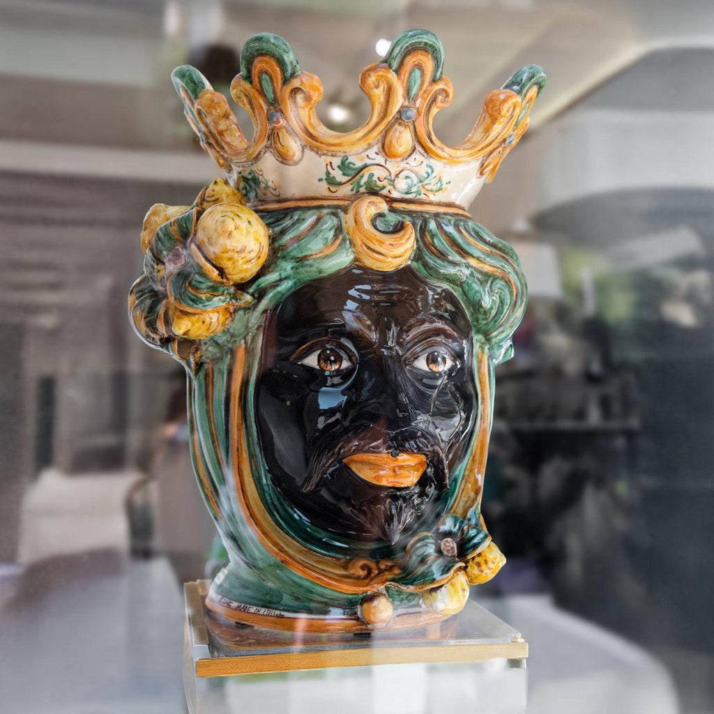 Handcrafted Teste di Moro ceramic vase with crown, vibrant green and gold details, traditional Sicilian art