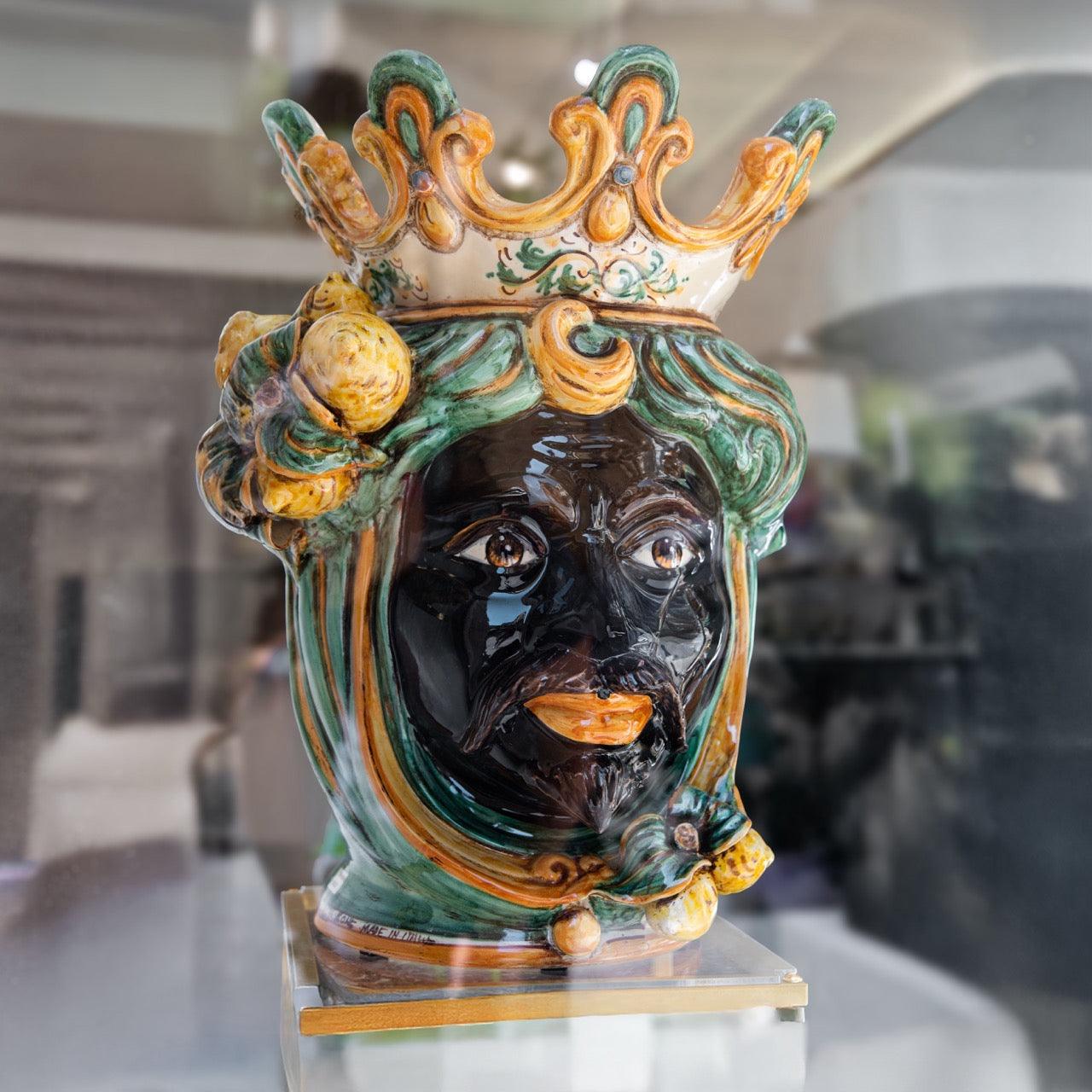 Handcrafted Teste di Moro ceramic vase with crown, vibrant green and gold details, traditional Sicilian art