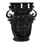 Black ceramic Teste di Moro vase with sculpted face, ornate crown, and five openings for home decor