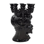 Black ceramic Teste di Moro candle holder with ornate crown and multiple arms, handmade decorative piece