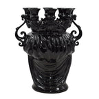 Glossy black Teste di Moro vase with ornate handles and multiple spouts, blending tradition and modern design.
