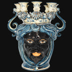 Handmade Teste di Moro ceramic candelabra with blue swirls, black face, and crown, blending tradition and modern design.