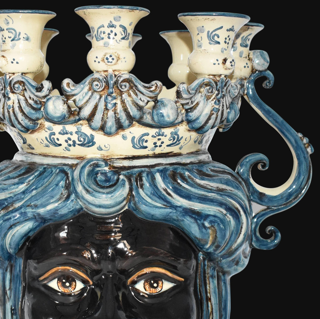 Handcrafted Teste di Moro candelabra with blue and white ceramic, ornate swirls, and expressive eyes
