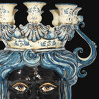 Handcrafted Teste di Moro candelabra with blue and white ceramic, ornate swirls, and expressive eyes